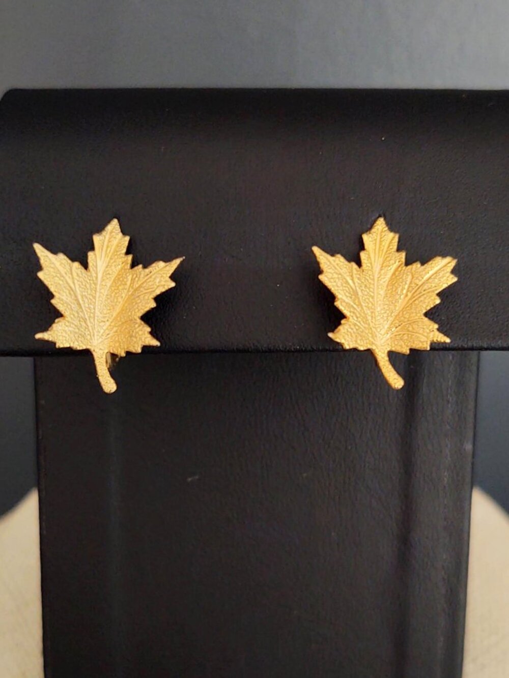 Clip on gold textured leaf earrings